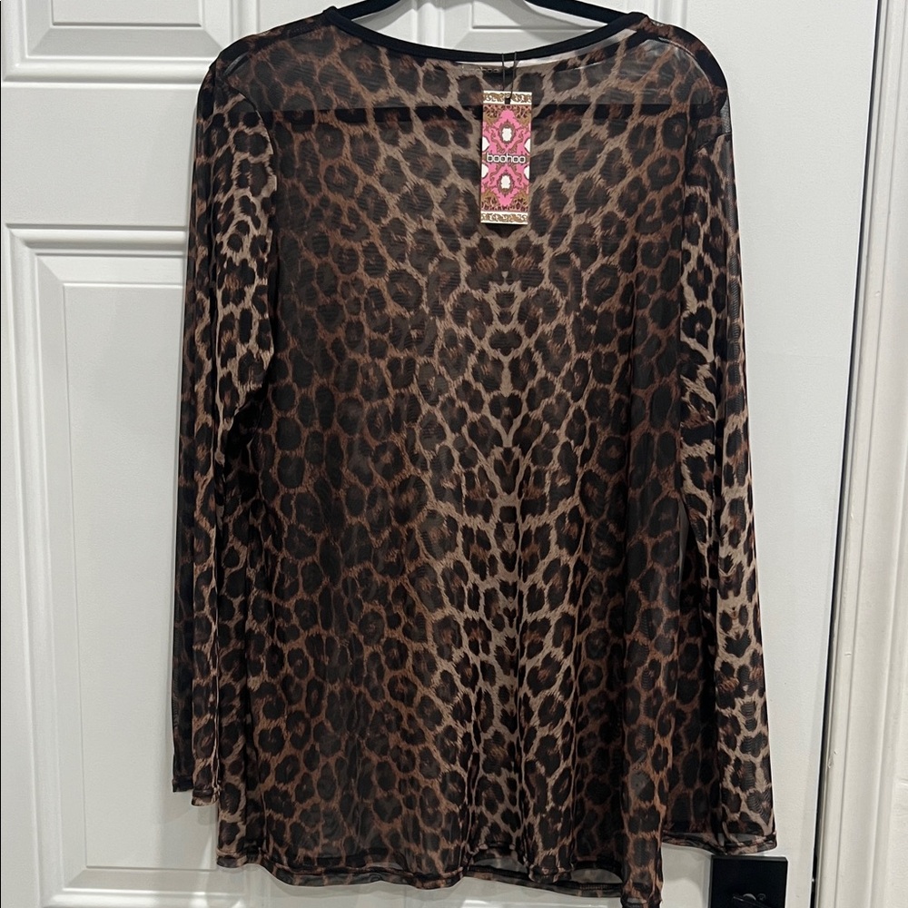 Brand new with tags size Us14. Leopard mesh long sleeve top.